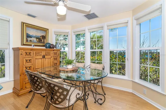 a view of a dining room with furniture window and wooden floor