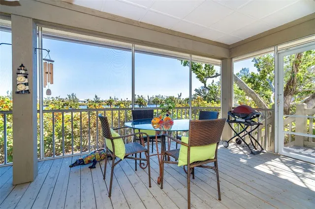 a bathroom with a granite countertop sink and large mirror
