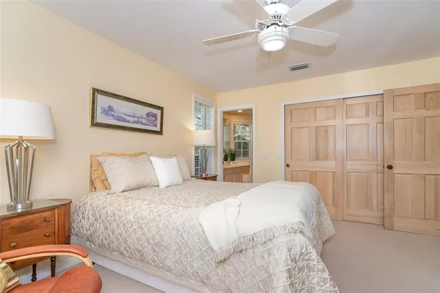 a spacious bedroom with a bed and a couch