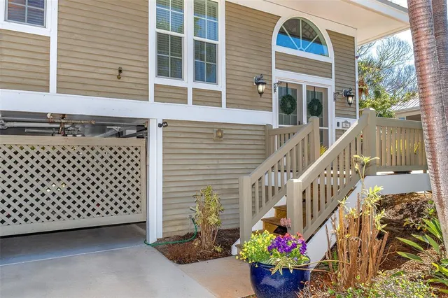 a front view of a house with a potted plant