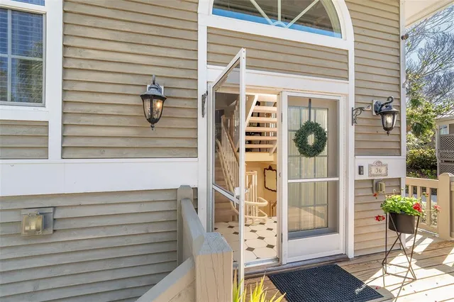 a view of entryway with wooden floor and stairs