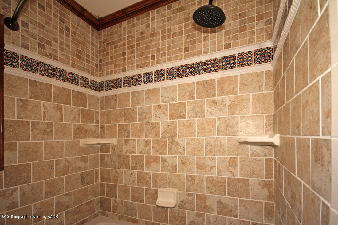 4313 South Bonham Street Amarillo, TX 79110 - Photo 17 of 21 a bathroom with a shower