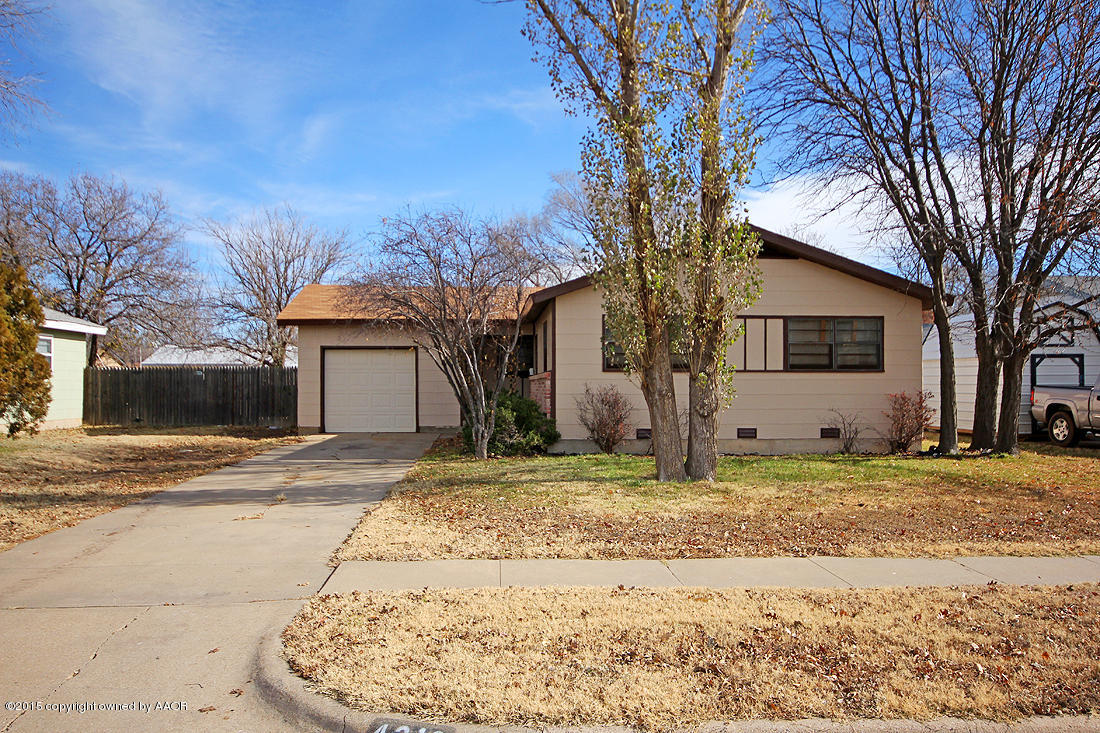 4313 South Bonham Street Amarillo, TX 79110 - Photo 2 of 21 a view of a house with snow on the road