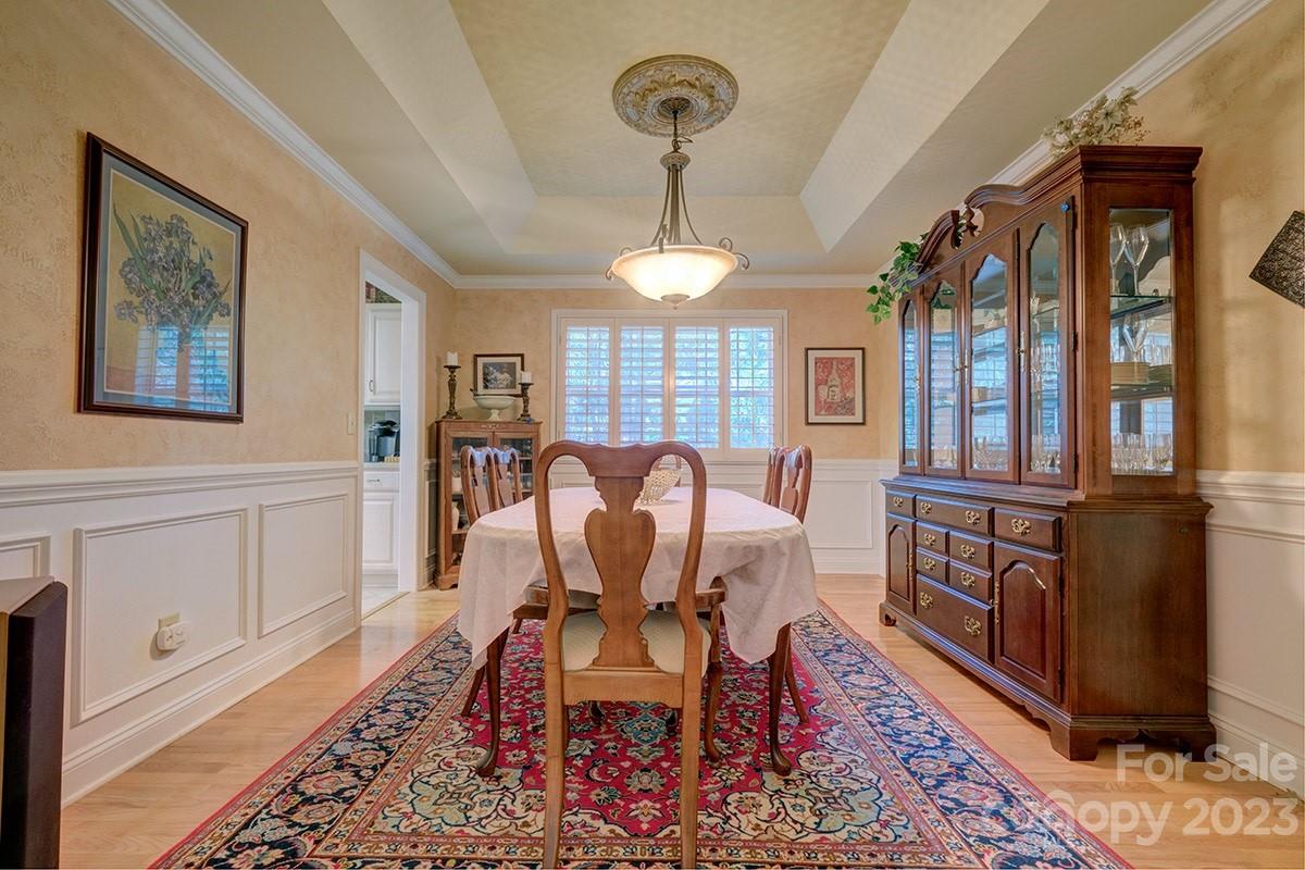 1129 Blowing Rock Cove Fort Mill, SC 29708 - Photo 14 of 37 a view of a dining room with furniture window and wooden floor