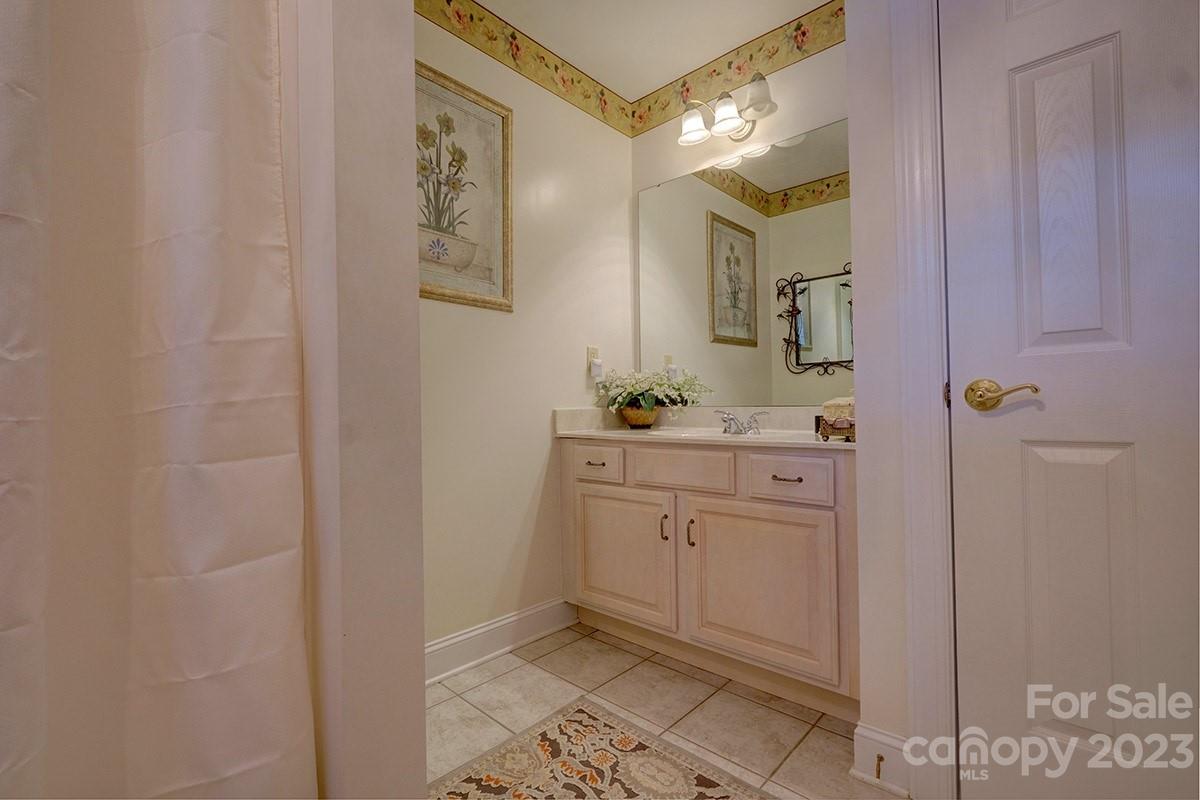 1129 Blowing Rock Cove Fort Mill, SC 29708 - Photo 23 of 37 a bathroom with a double vanity sink and a mirror