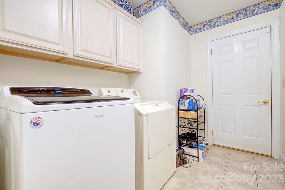 1129 Blowing Rock Cove Fort Mill, SC 29708 - Photo 26 of 37 a utility room with dryer and washer