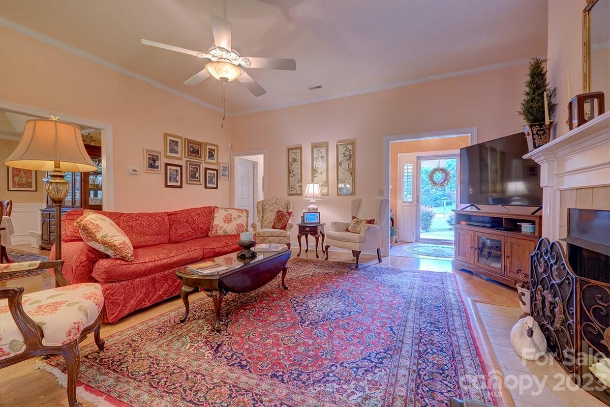1129 Blowing Rock Cove Fort Mill, SC 29708 - Photo 7 of 37 a living room with furniture flat screen tv and a fireplace