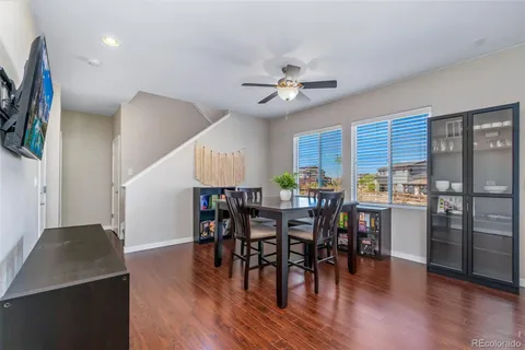 a view of a dining room with furniture and wooden floor