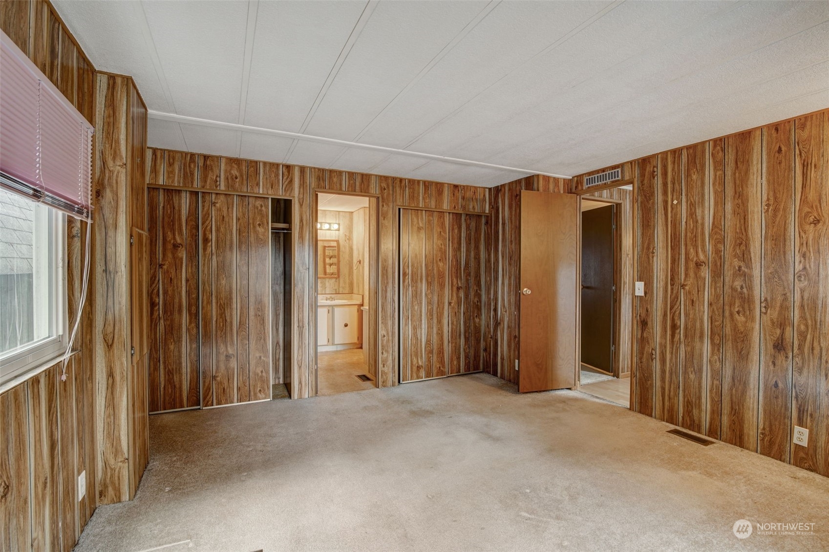 23708 Locust Way, Unit 28A Bothell, WA 98021 - Photo 18 of 40 a view of a room with a wooden door