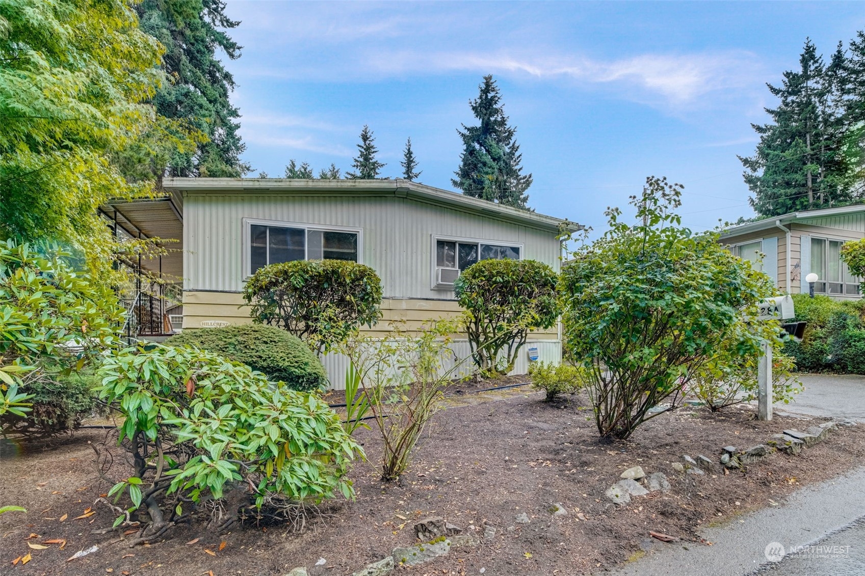 23708 Locust Way, Unit 28A Bothell, WA 98021 - Photo 2 of 40 a view of a house with a yard and plants