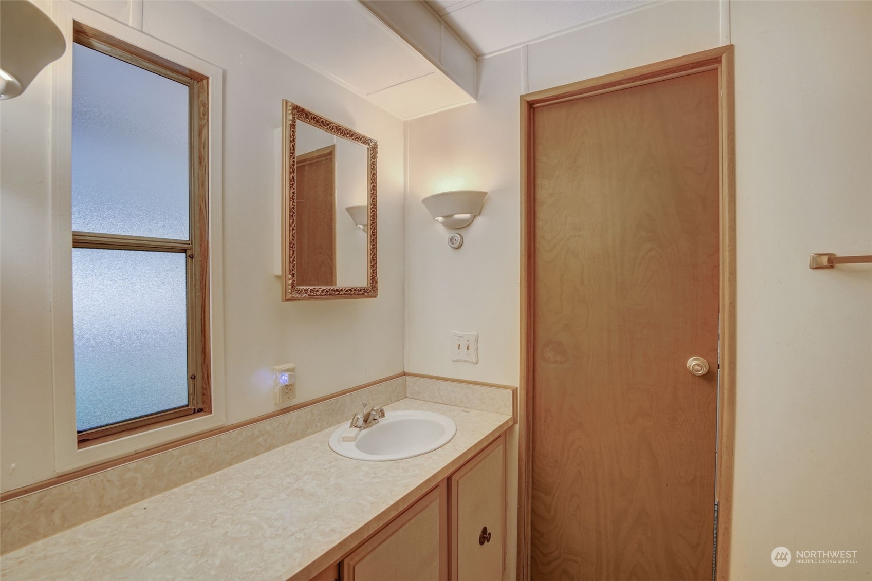 23708 Locust Way, Unit 28A Bothell, WA 98021 - Photo 25 of 40 a bathroom with a sink and a mirror
