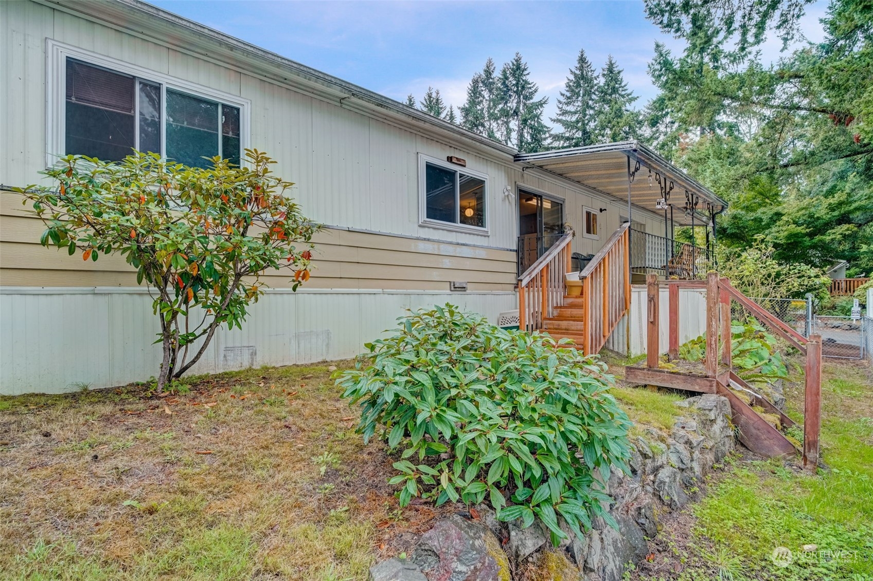 23708 Locust Way, Unit 28A Bothell, WA 98021 - Photo 29 of 40 a house that has a tree in front of the house
