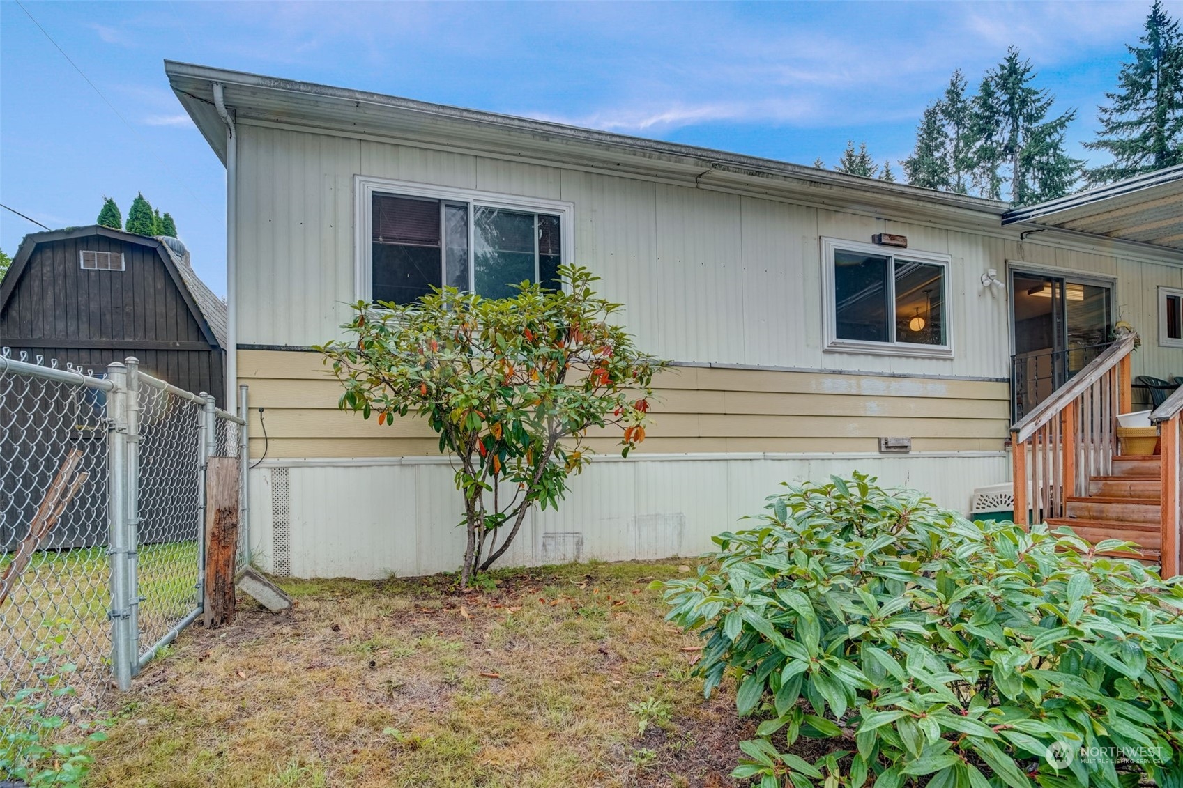 23708 Locust Way, Unit 28A Bothell, WA 98021 - Photo 30 of 40 a potted plant sitting in front of a house