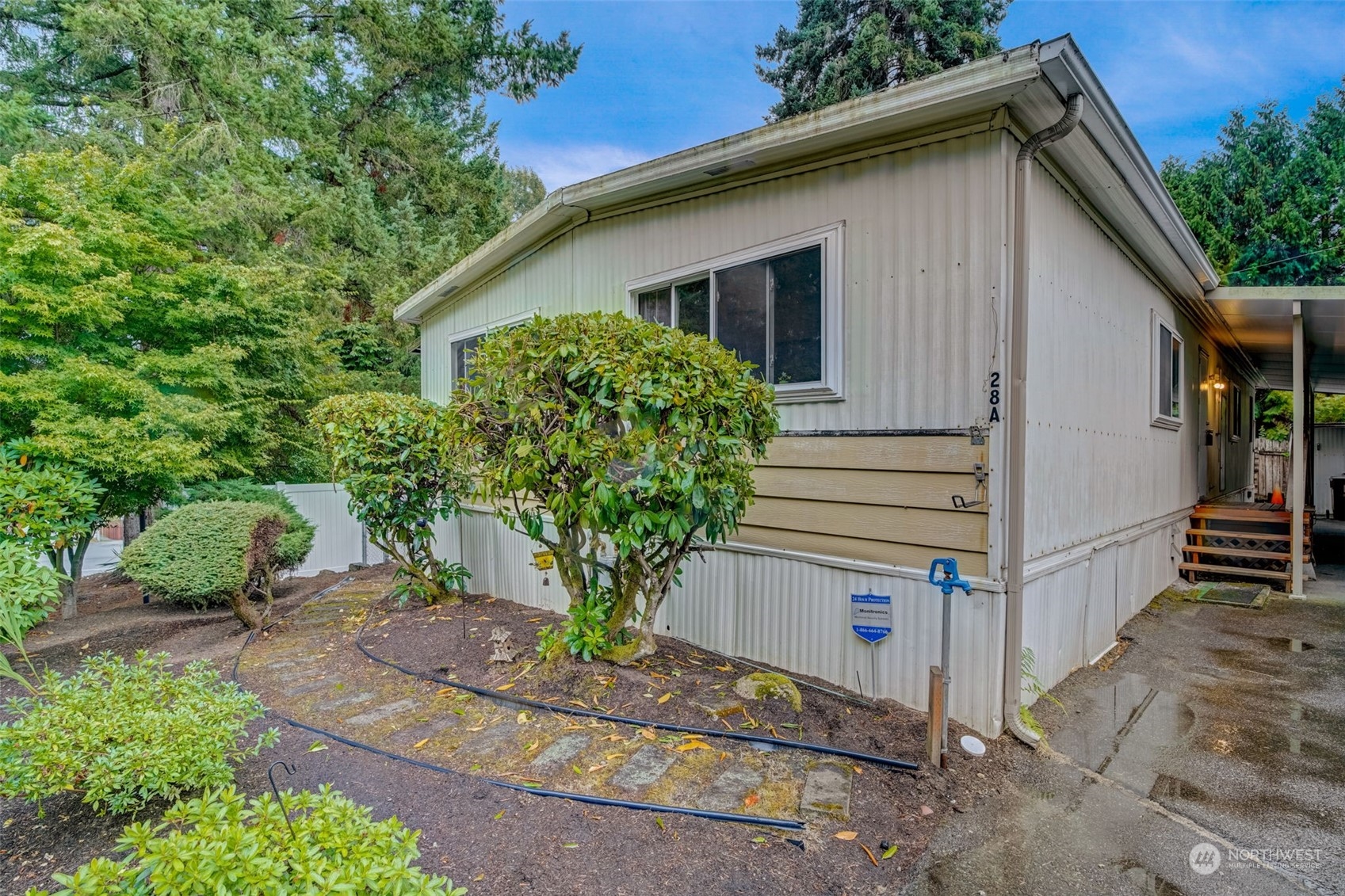 23708 Locust Way, Unit 28A Bothell, WA 98021 - Photo 3 of 40 a front view of a house with garden