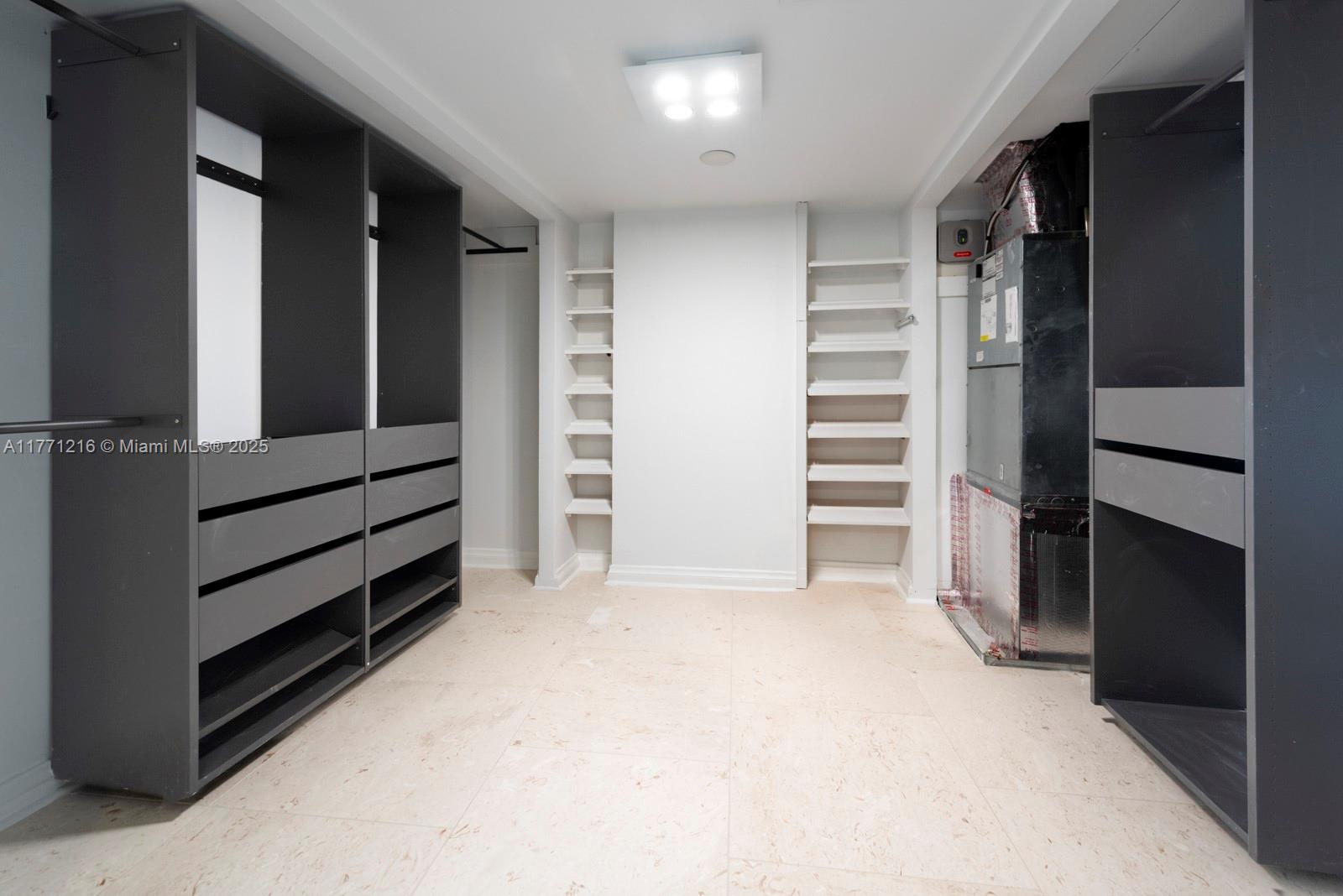 333 Sunset Drive, Unit 804 Fort Lauderdale, FL 33301 - Photo 19 of 28 a view of walk in closet with clothes and shoes