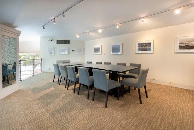 a view of a terrace with lawn chairs