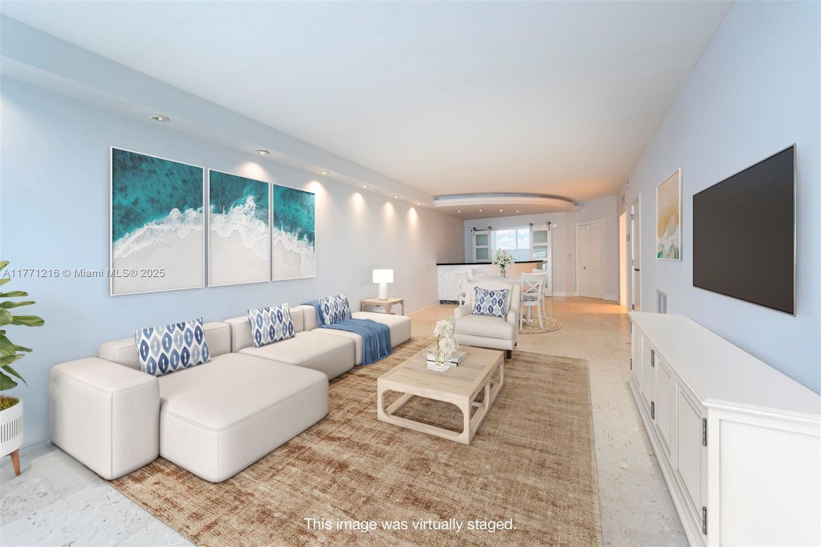 333 Sunset Drive, Unit 804 Fort Lauderdale, FL 33301 - Photo 6 of 28 a living room with furniture and a flat screen tv