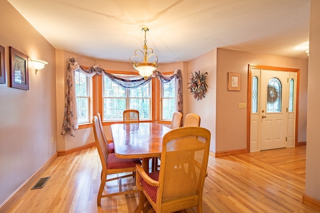 48 Easter Brook Road Lunenburg, MA 01462 - Photo 12 of 38 a view of a dining room with furniture window and wooden floor