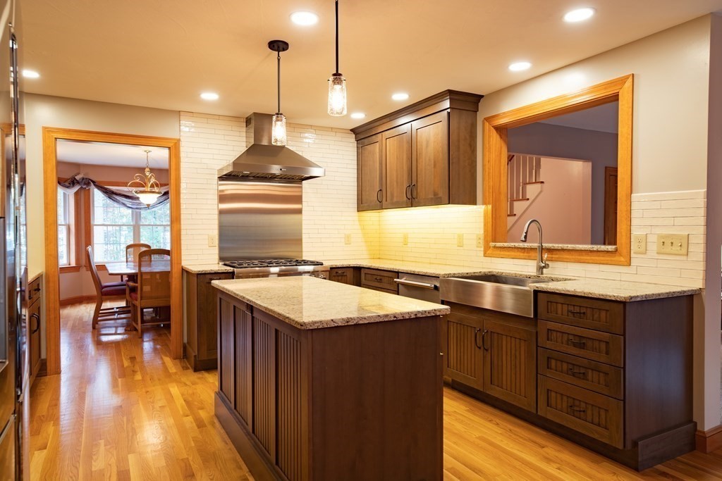 48 Easter Brook Road Lunenburg, MA 01462 - Photo 16 of 38 a kitchen with a sink stove and wooden floor