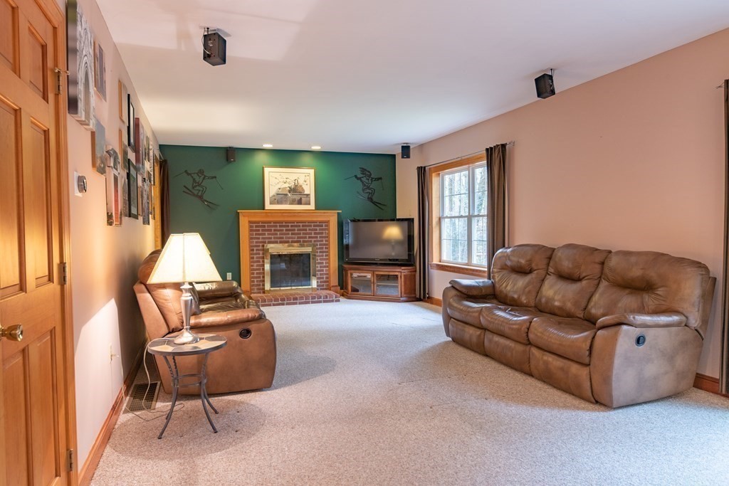 48 Easter Brook Road Lunenburg, MA 01462 - Photo 20 of 38 a living room with furniture and a fireplace