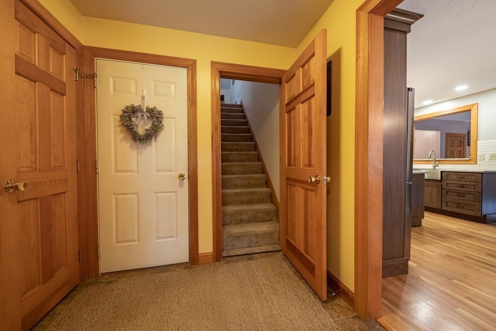 48 Easter Brook Road Lunenburg, MA 01462 - Photo 35 of 38 a view of a hallway with wooden floor and staircase