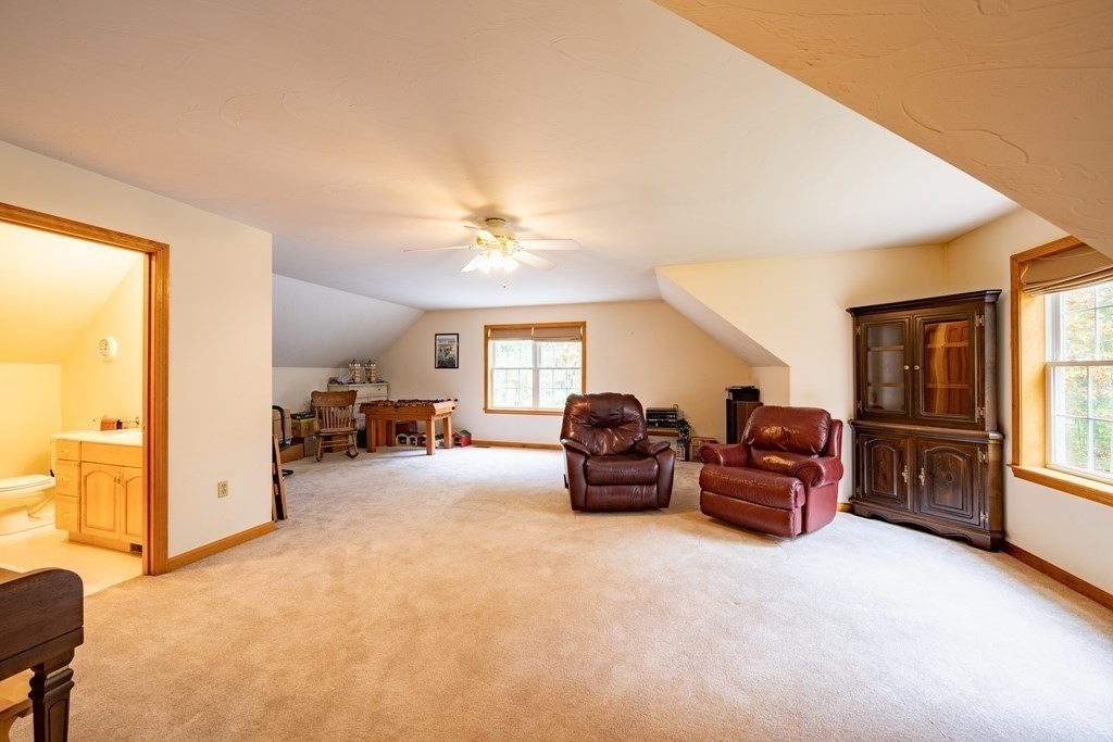 48 Easter Brook Road Lunenburg, MA 01462 - Photo 36 of 38 a living room with furniture and a chandelier