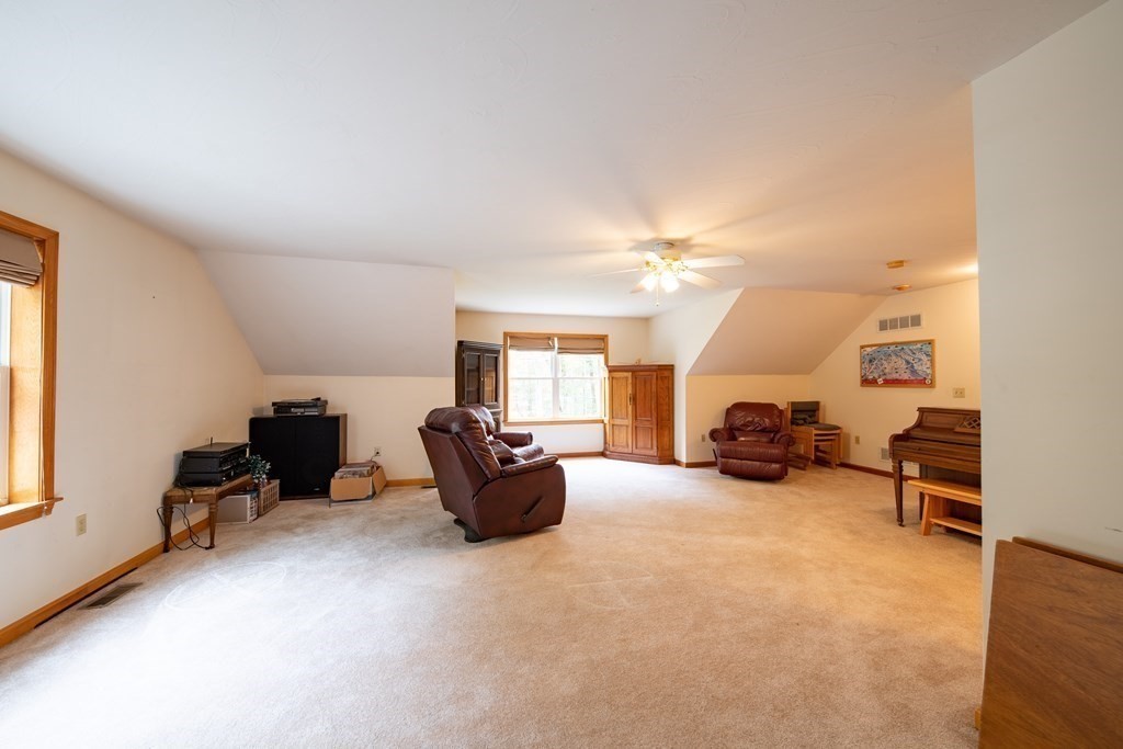48 Easter Brook Road Lunenburg, MA 01462 - Photo 37 of 38 a living room with furniture and a flat screen tv