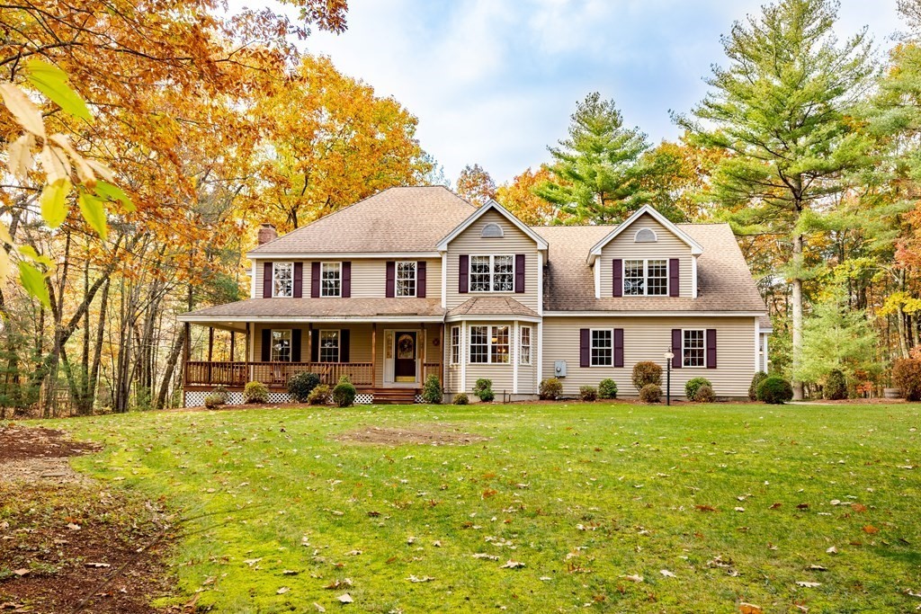 48 Easter Brook Road Lunenburg, MA 01462 - Photo 5 of 38 a front view of a house with a yard table and chairs