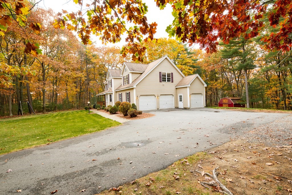 48 Easter Brook Road Lunenburg, MA 01462 - Photo 6 of 38 a view of white house with a yard