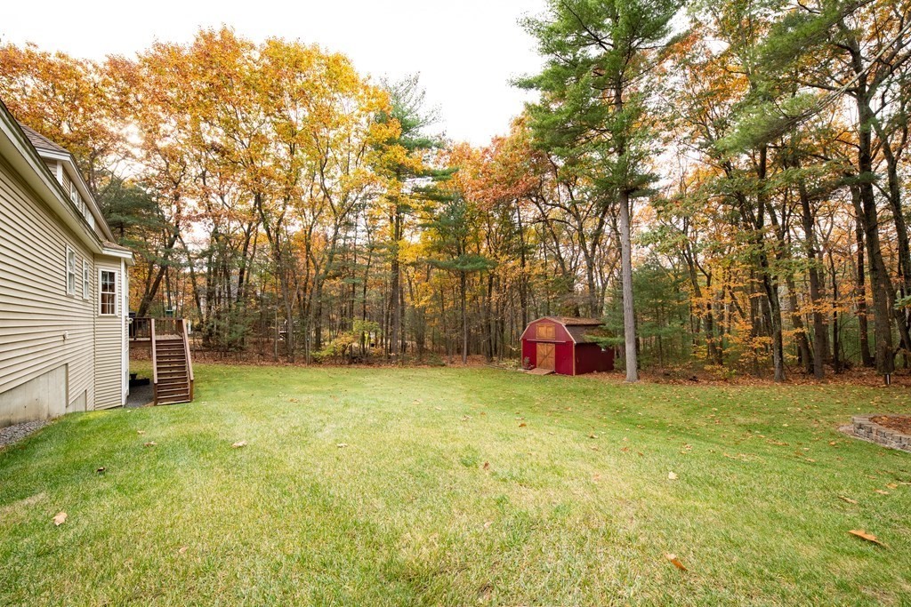48 Easter Brook Road Lunenburg, MA 01462 - Photo 7 of 38 a view of a yard with a house