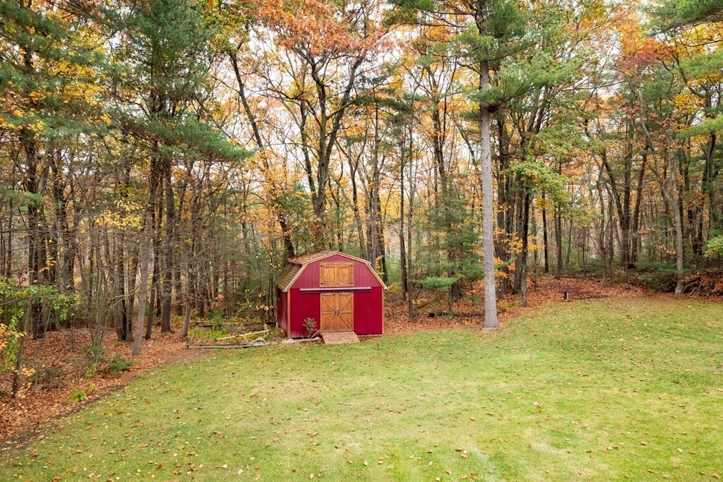 48 Easter Brook Road Lunenburg, MA 01462 - Photo 8 of 38 a view of backyard with swimming pool and seating