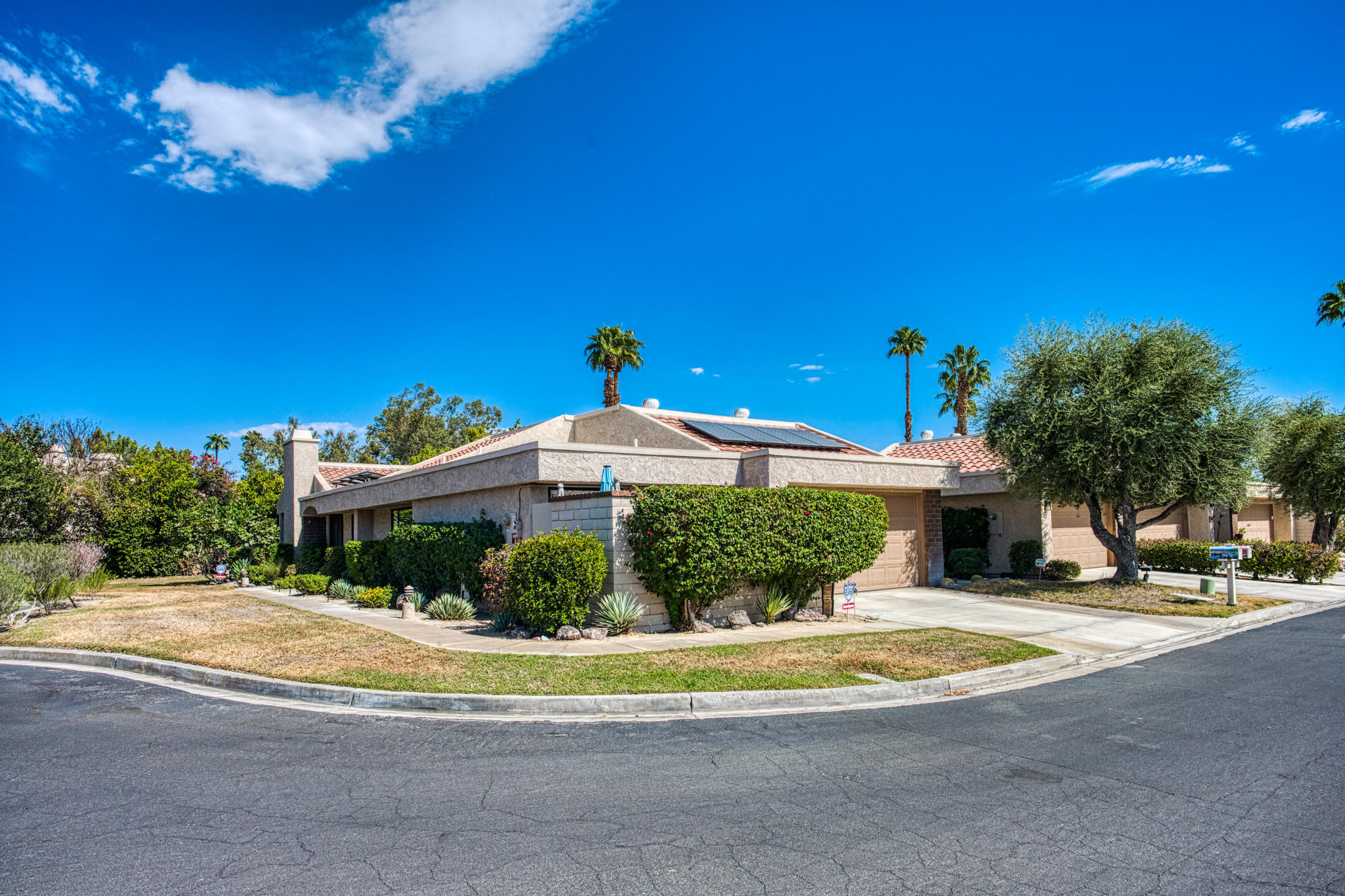 68640 Calle Mancha Cathedral City, CA 92234 - Photo 1 of 54 a front view of a house with a yard