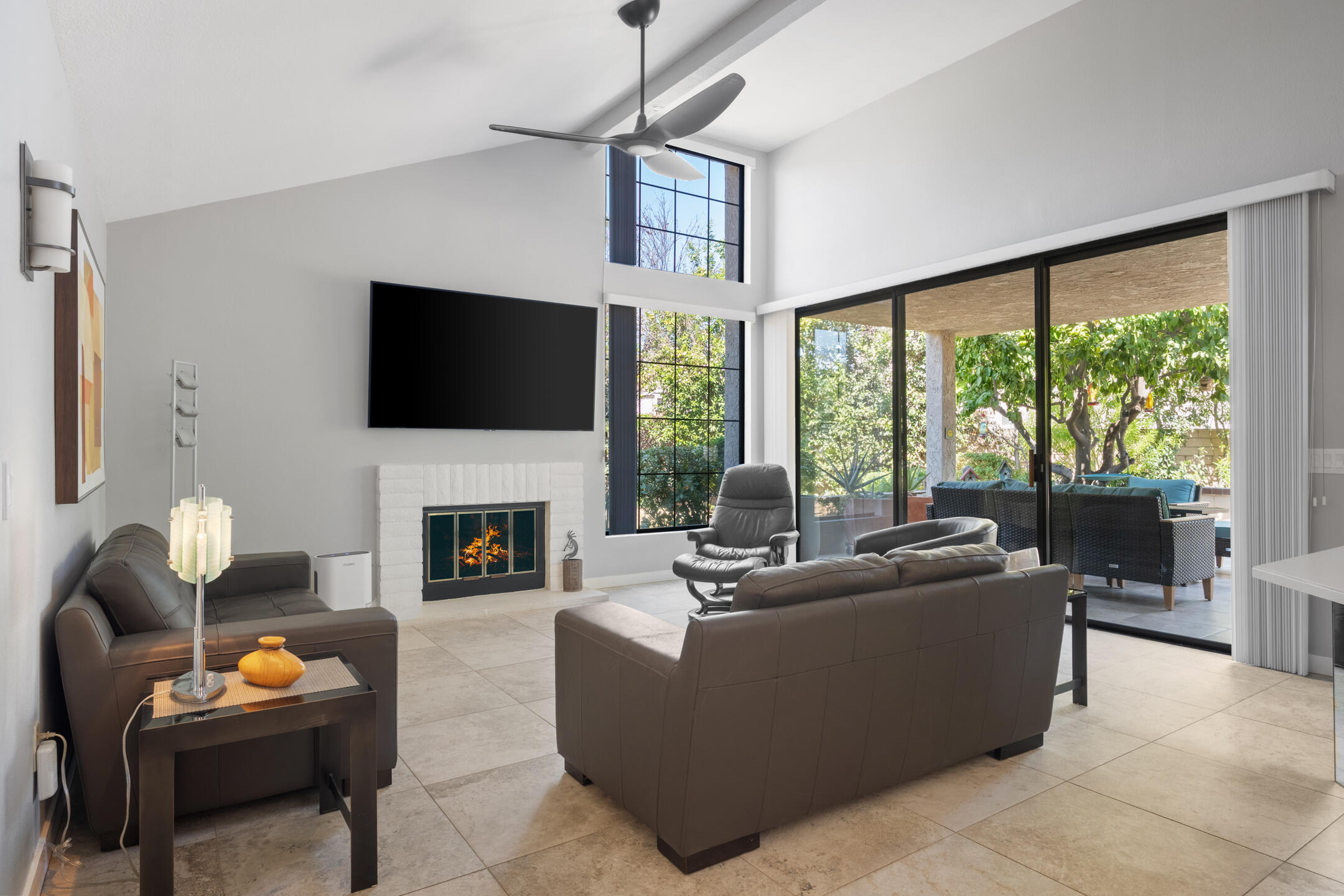 68640 Calle Mancha Cathedral City, CA 92234 - Photo 11 of 54 a living room with furniture a fireplace and a flat screen tv