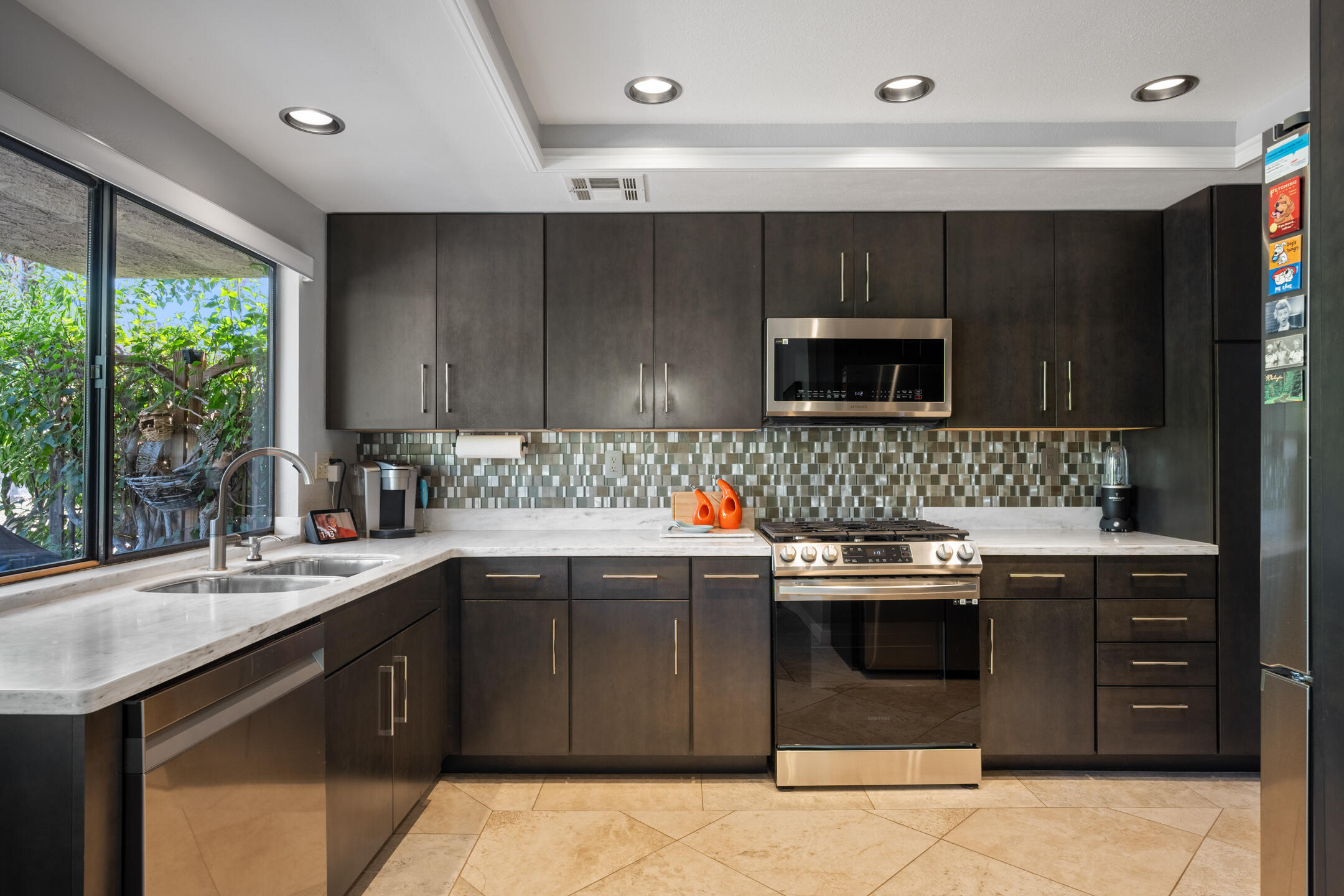 68640 Calle Mancha Cathedral City, CA 92234 - Photo 18 of 54 a kitchen with stainless steel appliances a sink and a stove top oven