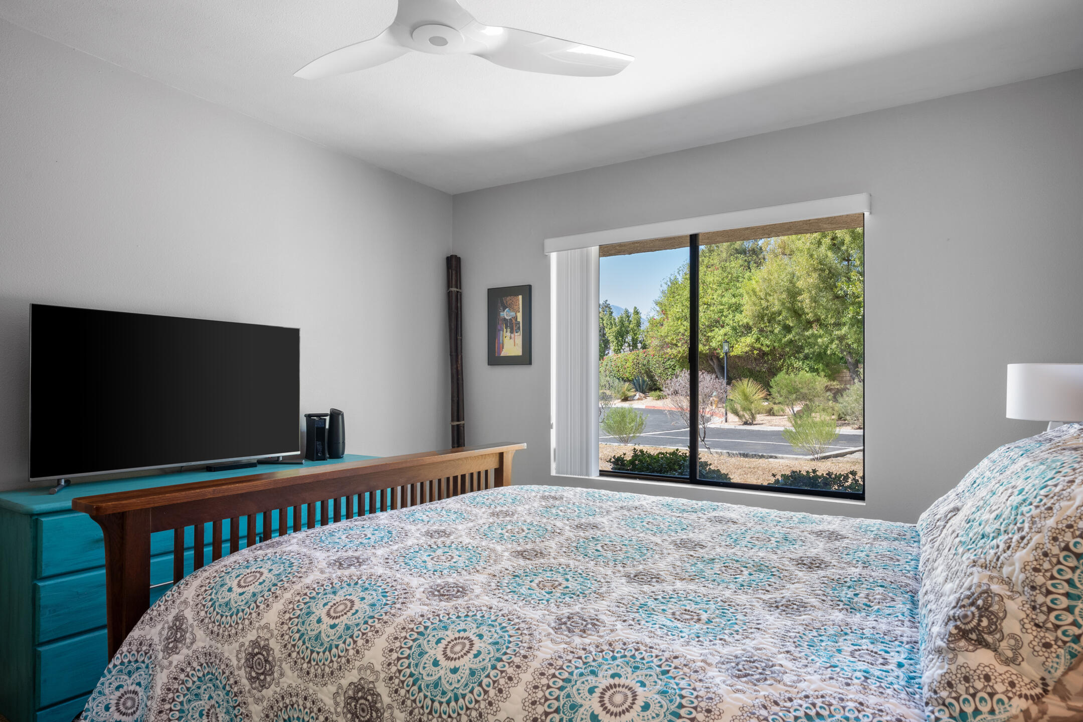 68640 Calle Mancha Cathedral City, CA 92234 - Photo 31 of 54 a bedroom with a bed and a flat screen tv