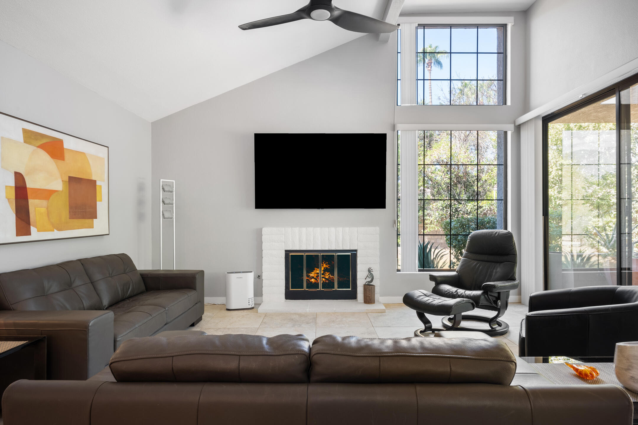 68640 Calle Mancha Cathedral City, CA 92234 - Photo 10 of 54 a living room with furniture a fireplace and a flat screen tv