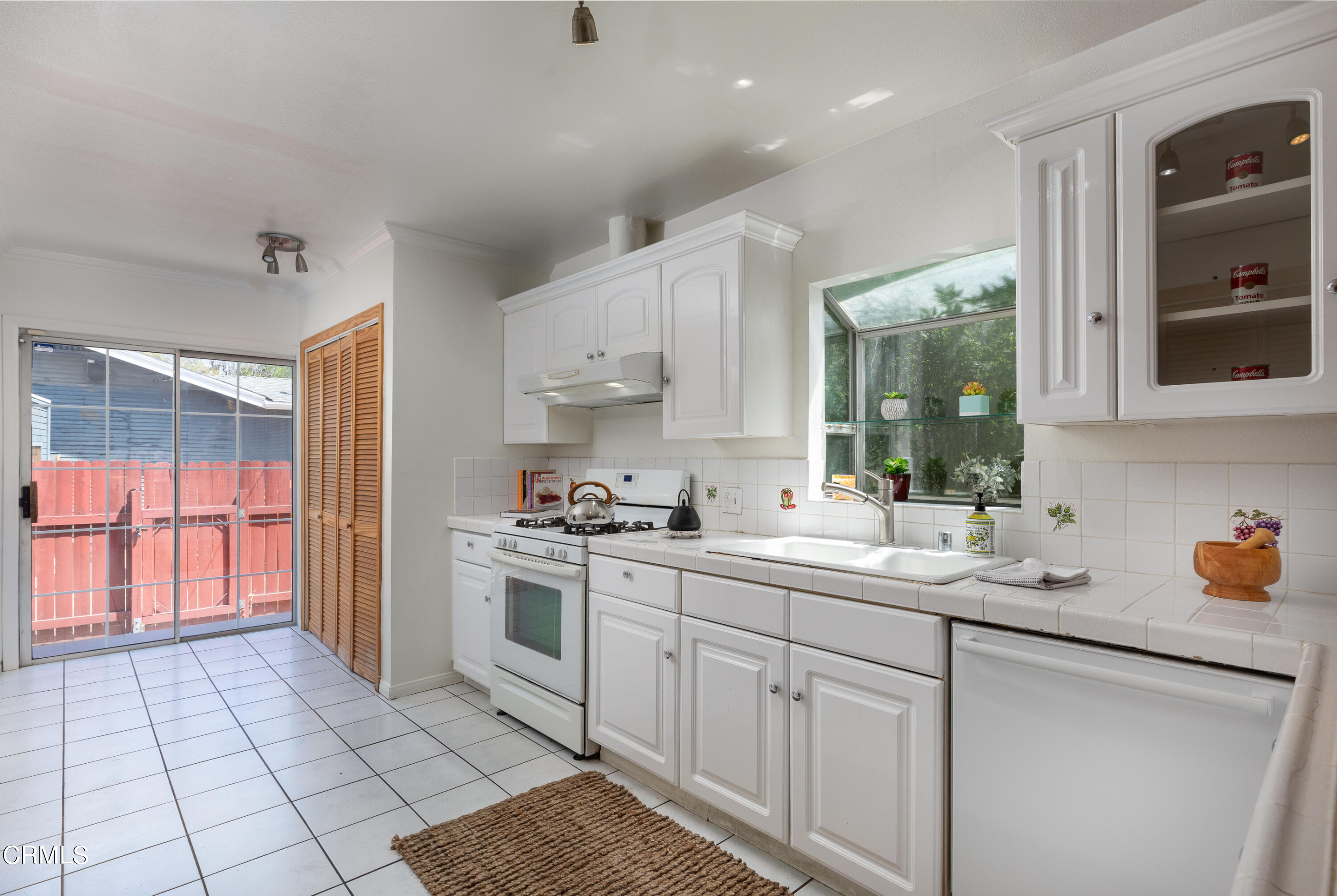 1710 North Ave 46 Eagle Rock, CA 90041 - Photo 13 of 30 a kitchen with a sink a stove and cabinets
