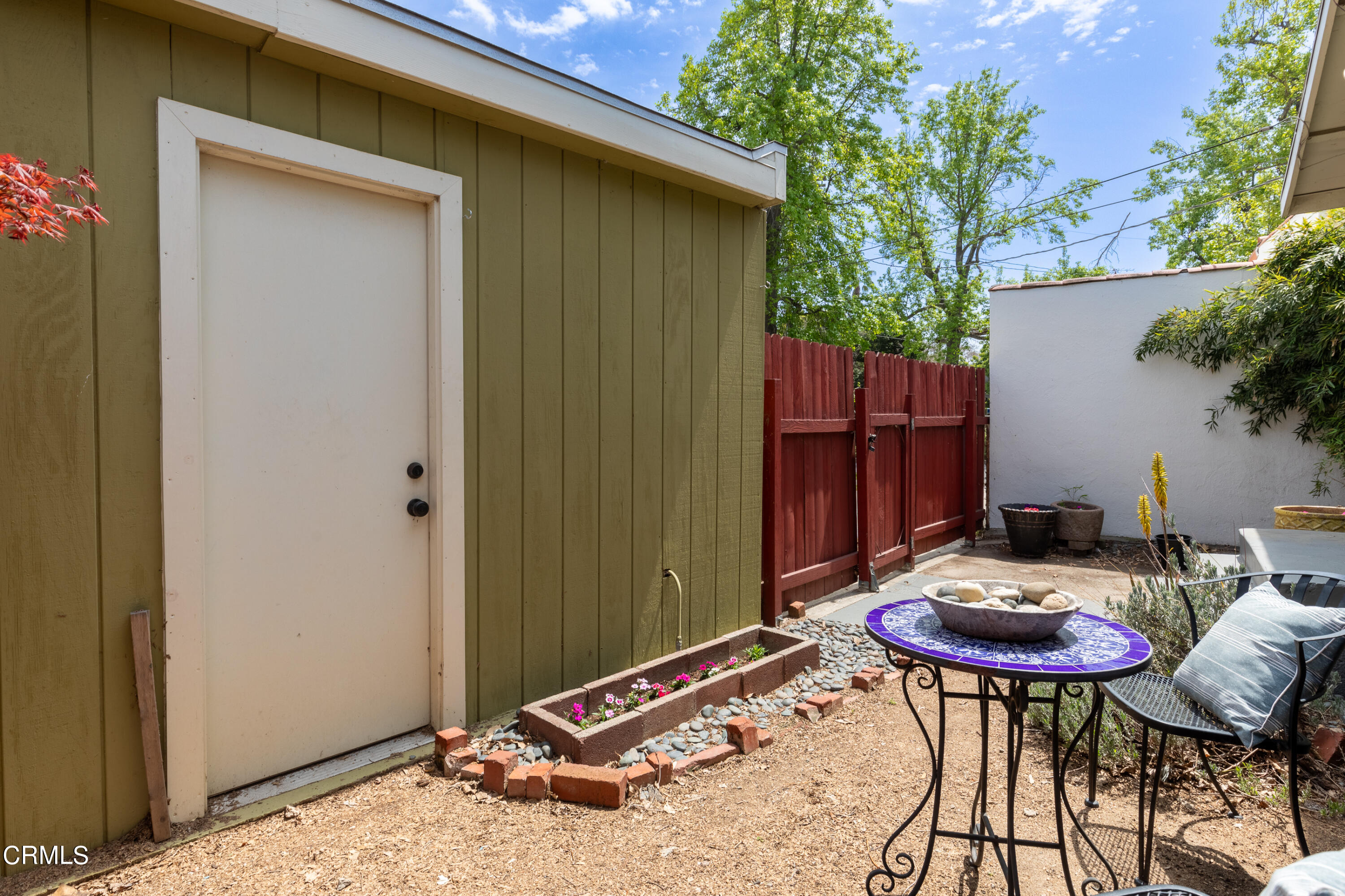 1710 North Ave 46 Eagle Rock, CA 90041 - Photo 24 of 30 a backyard with table and chairs potted plants and wooden fence