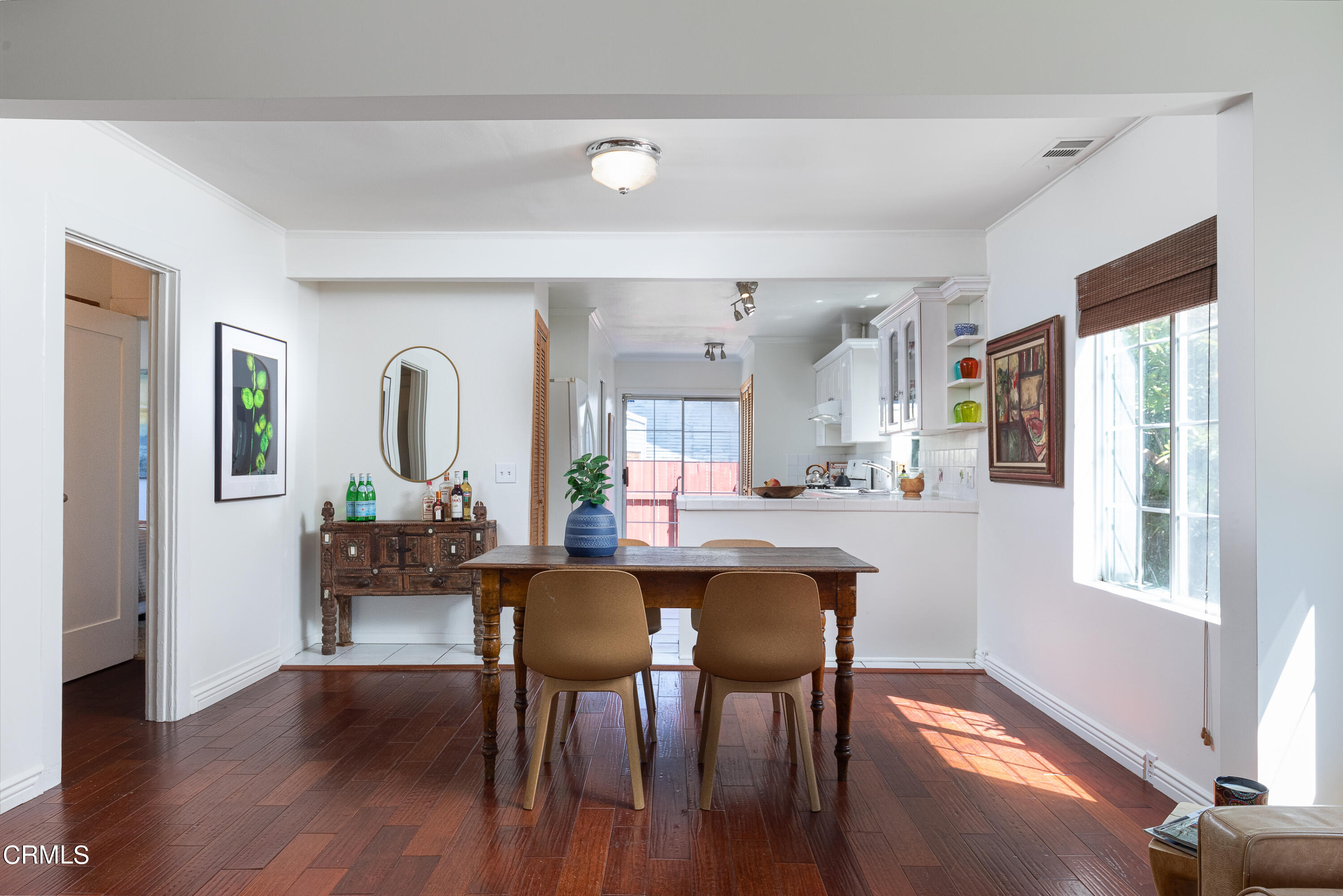 1710 North Ave 46 Eagle Rock, CA 90041 - Photo 9 of 30 a dining room with furniture a rug and wooden floor