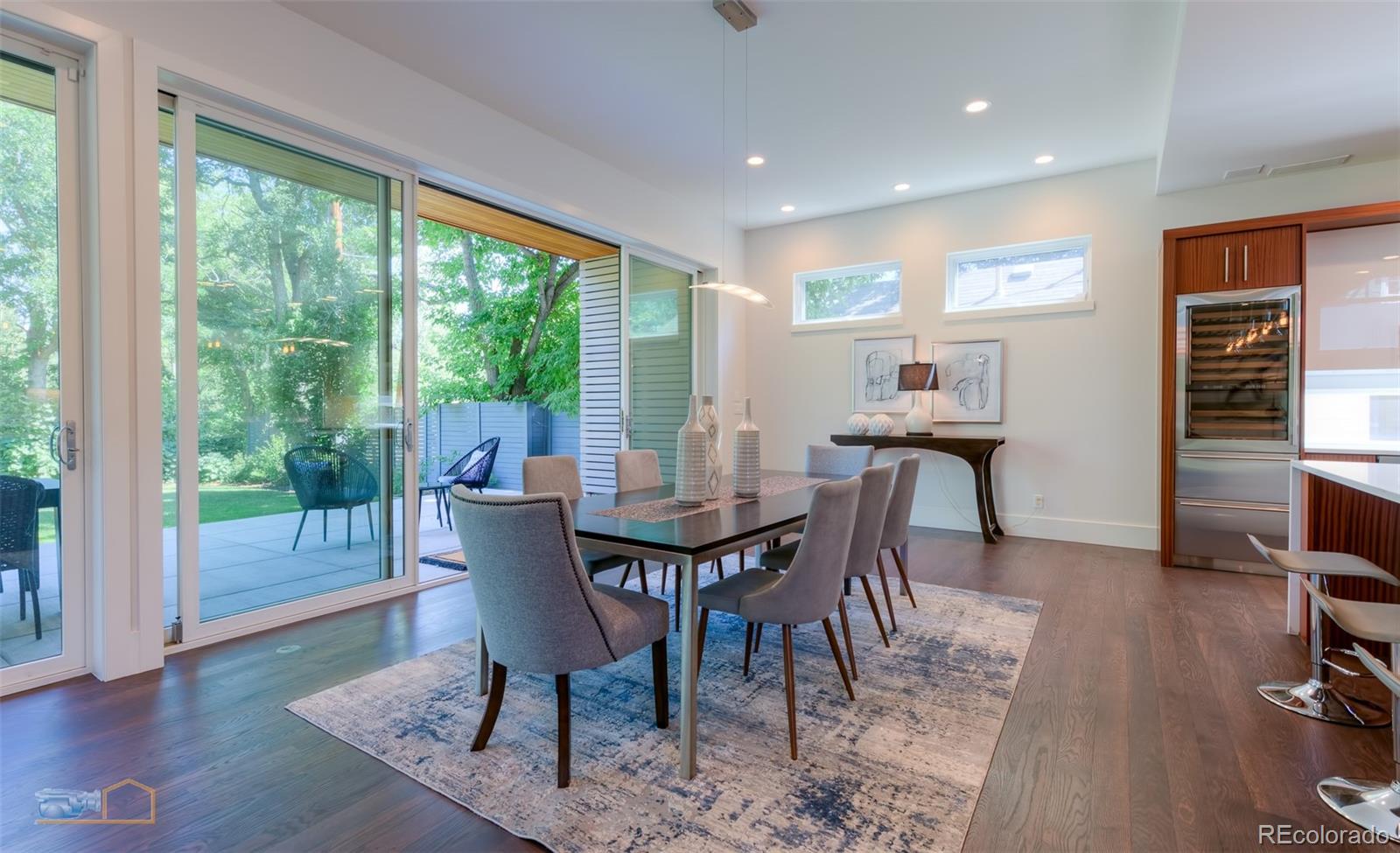 441 Arapahoe Avenue Boulder, CO 80302 - Photo 12 of 40 a view of a dining room with furniture window and wooden floor