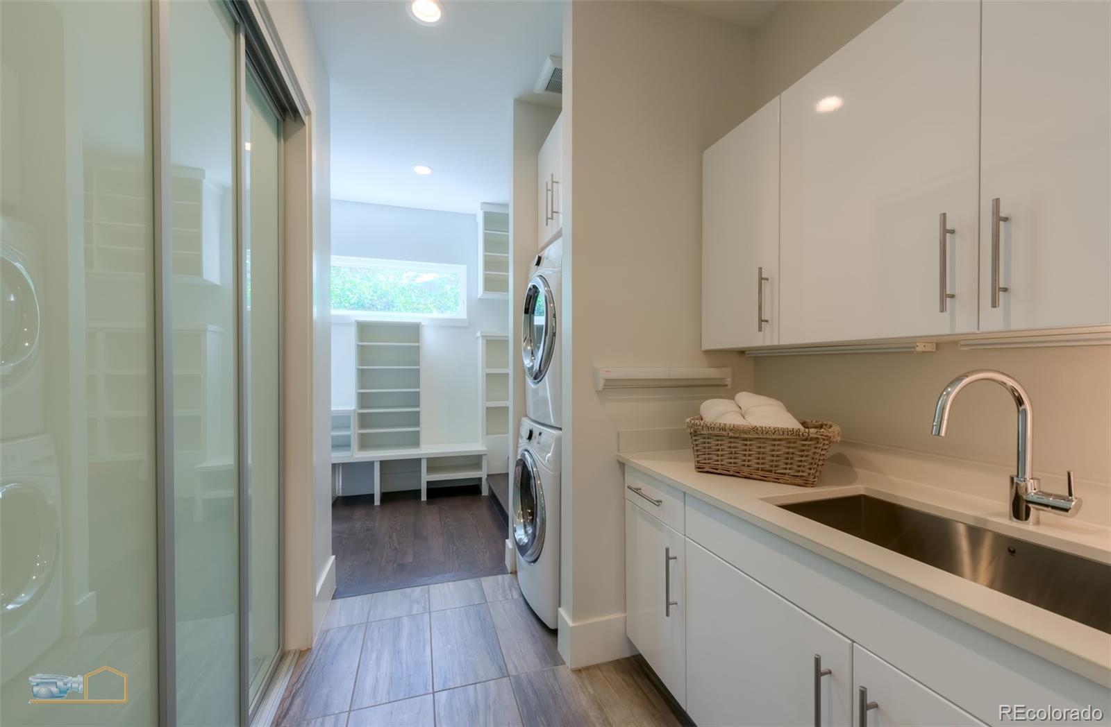 441 Arapahoe Avenue Boulder, CO 80302 - Photo 20 of 40 a kitchen with a sink a refrigerator and cabinets