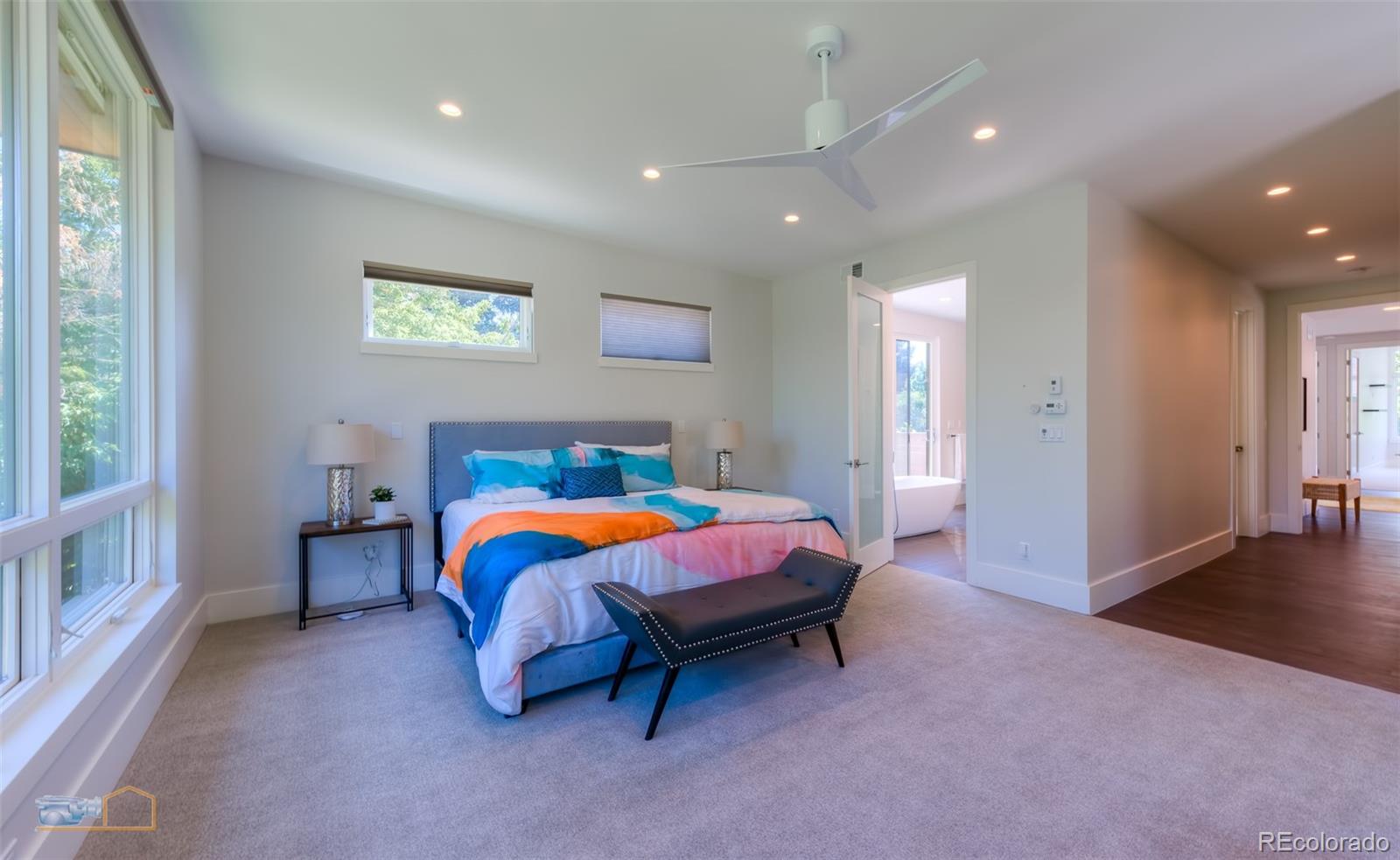 441 Arapahoe Avenue Boulder, CO 80302 - Photo 23 of 40 a spacious bedroom with a bed and a window
