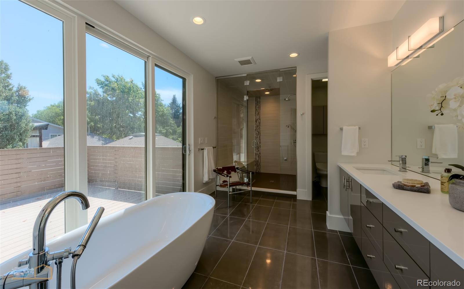 441 Arapahoe Avenue Boulder, CO 80302 - Photo 24 of 40 a bathroom with a double vanity sink and a bathtub