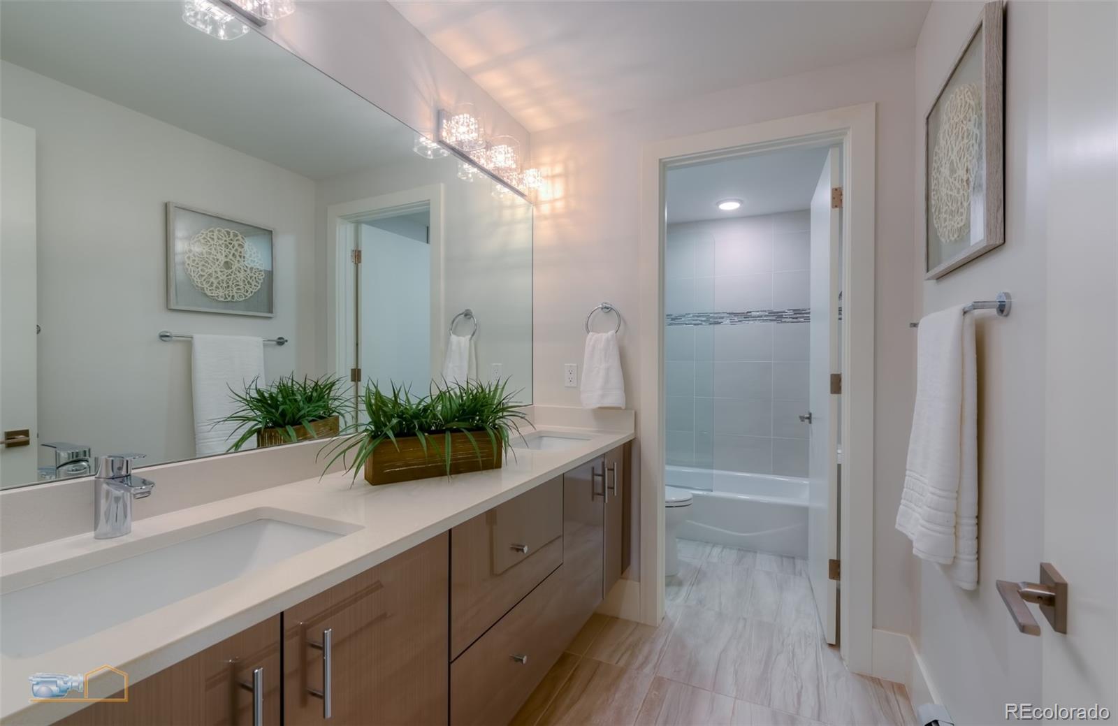 441 Arapahoe Avenue Boulder, CO 80302 - Photo 32 of 40 a bathroom with a double vanity sink and mirror
