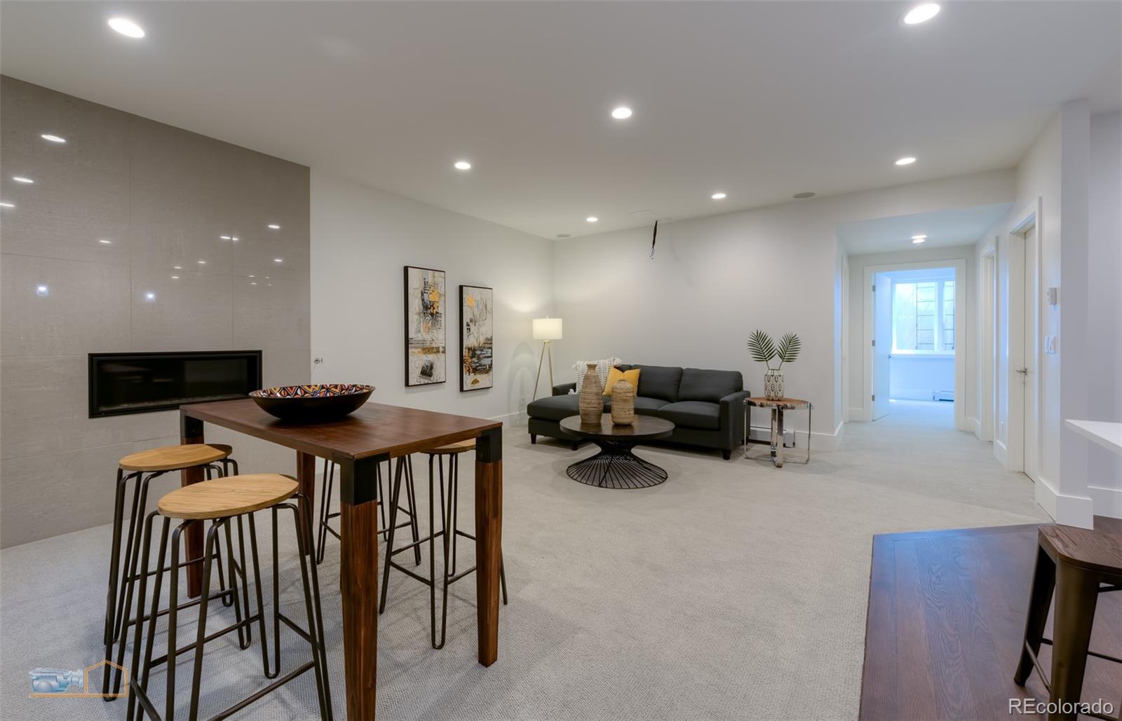 441 Arapahoe Avenue Boulder, CO 80302 - Photo 34 of 40 a living room with furniture and a flat screen tv
