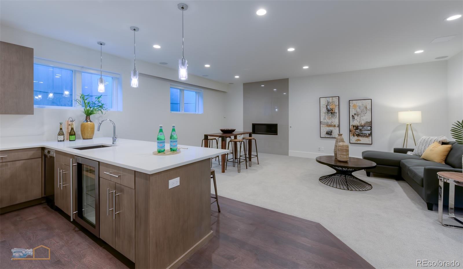 441 Arapahoe Avenue Boulder, CO 80302 - Photo 35 of 40 a kitchen with kitchen island granite countertop a sink a counter top space and living room view