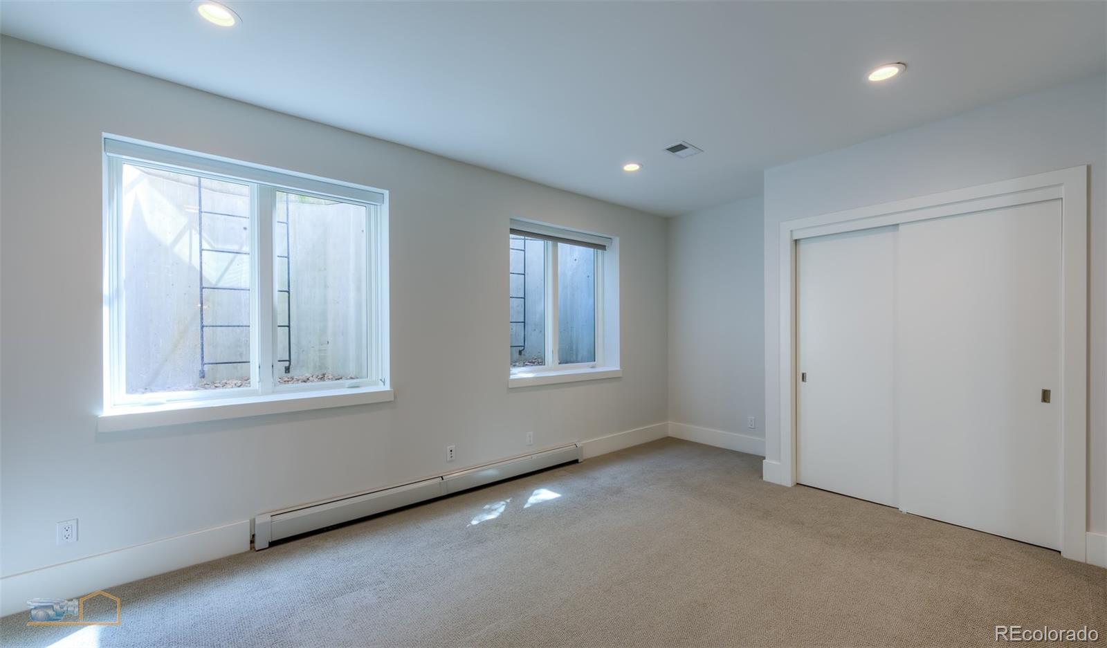441 Arapahoe Avenue Boulder, CO 80302 - Photo 39 of 40 an empty room with windows