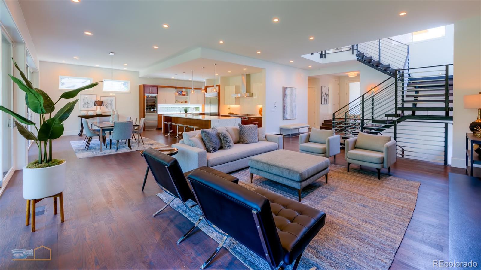 441 Arapahoe Avenue Boulder, CO 80302 - Photo 6 of 40 a living room with furniture kitchen view and a wooden floor