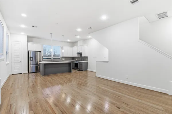 a view of kitchen with wooden floor