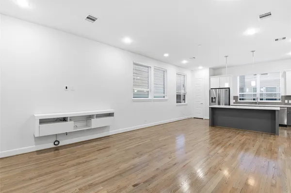a view of kitchen with wooden floor and window